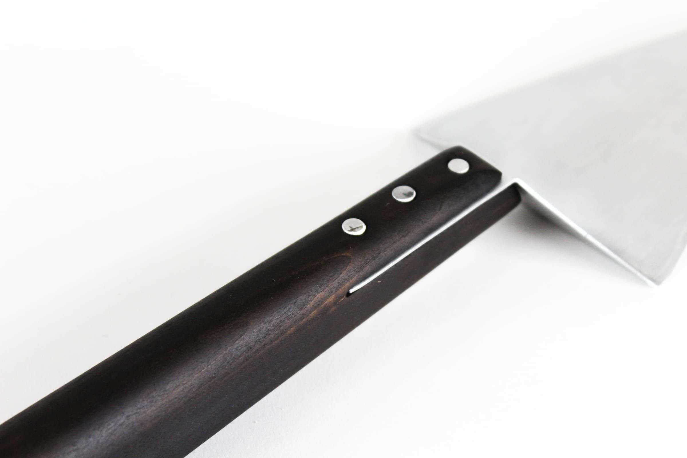 Close-up of the fired maple handle and rivets